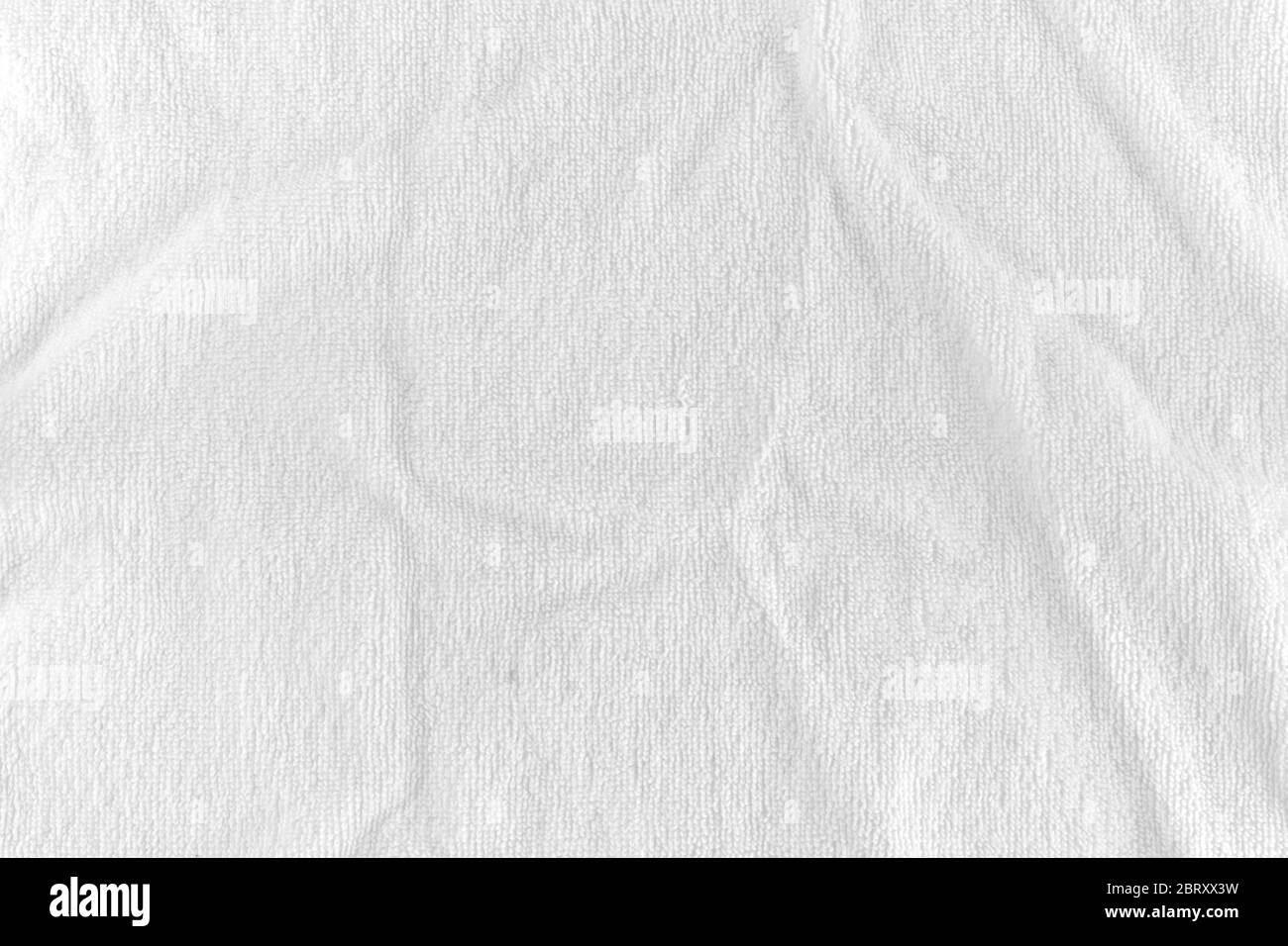 Tessuto bianco sfondo con onde morbide. Messa a fuoco selettiva Foto Stock