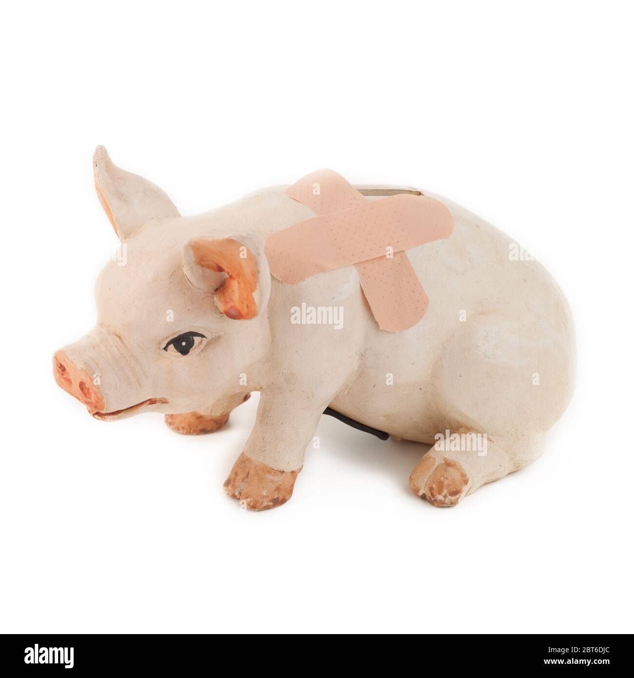 Banco di piggy con intonaco adesivo su sfondo bianco Foto Stock