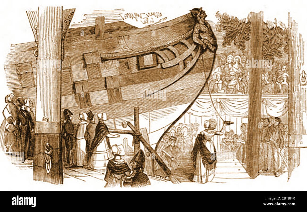 Lanciando una nave a vela in legno nel 1840 nel modo tradizionale rompendo una bottiglia 'sacrificale' di birra o vino (che rappresenta il sangue), durante la sua cerimonia di denominazione. L'uso dello champagne è stato un'aggiunta più recente e prestigiosa. L'elemento religioso visto in alcune cerimonie è stato detto essere stato introdotto dalla principessa Alexandra, moglie del principe di Galles, quando ha chiesto un servizio corale anglicano nella cerimonia di lancio per la corazzata Alexandra nel 1875. Foto Stock