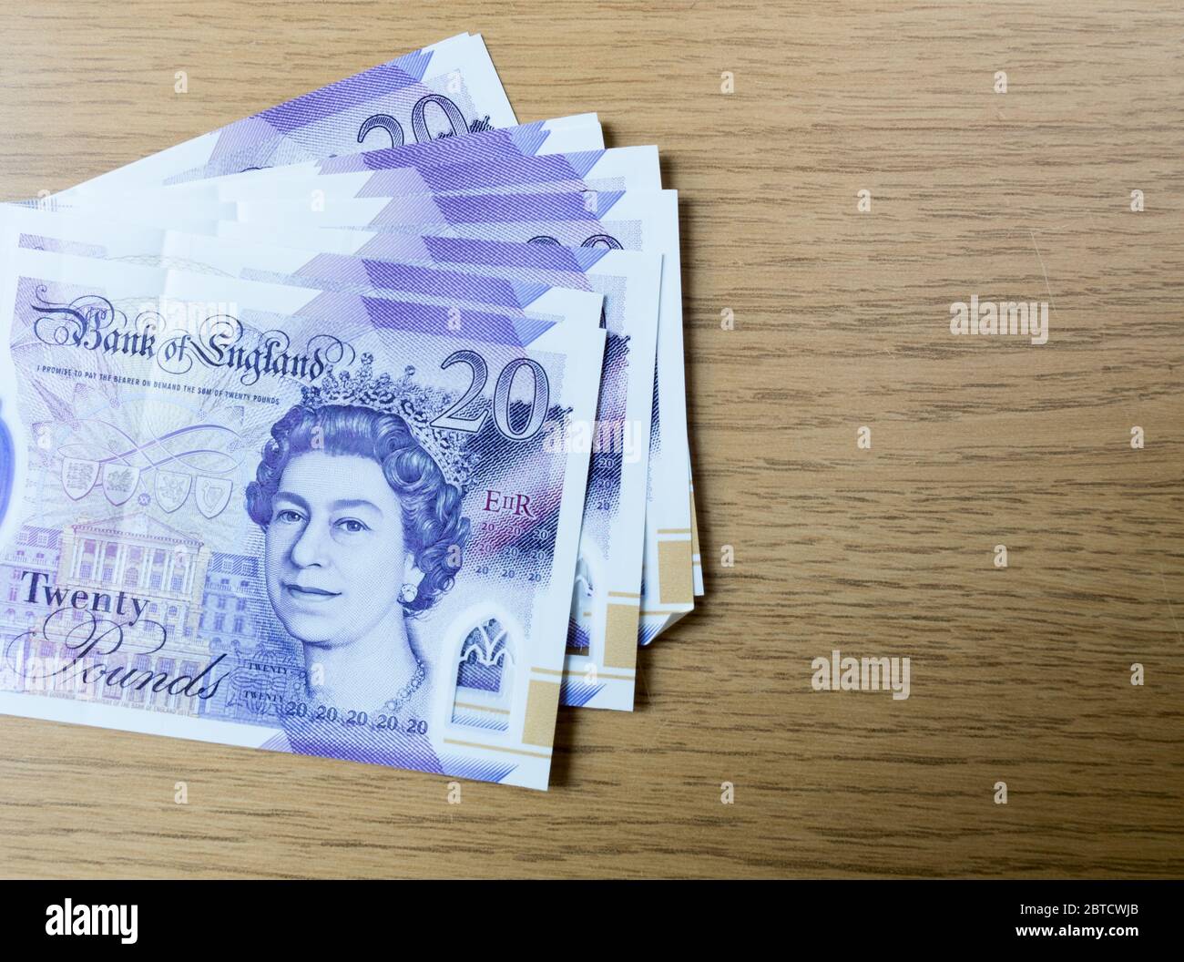 Banconote e monete in polimero in sterlina britannica Foto Stock