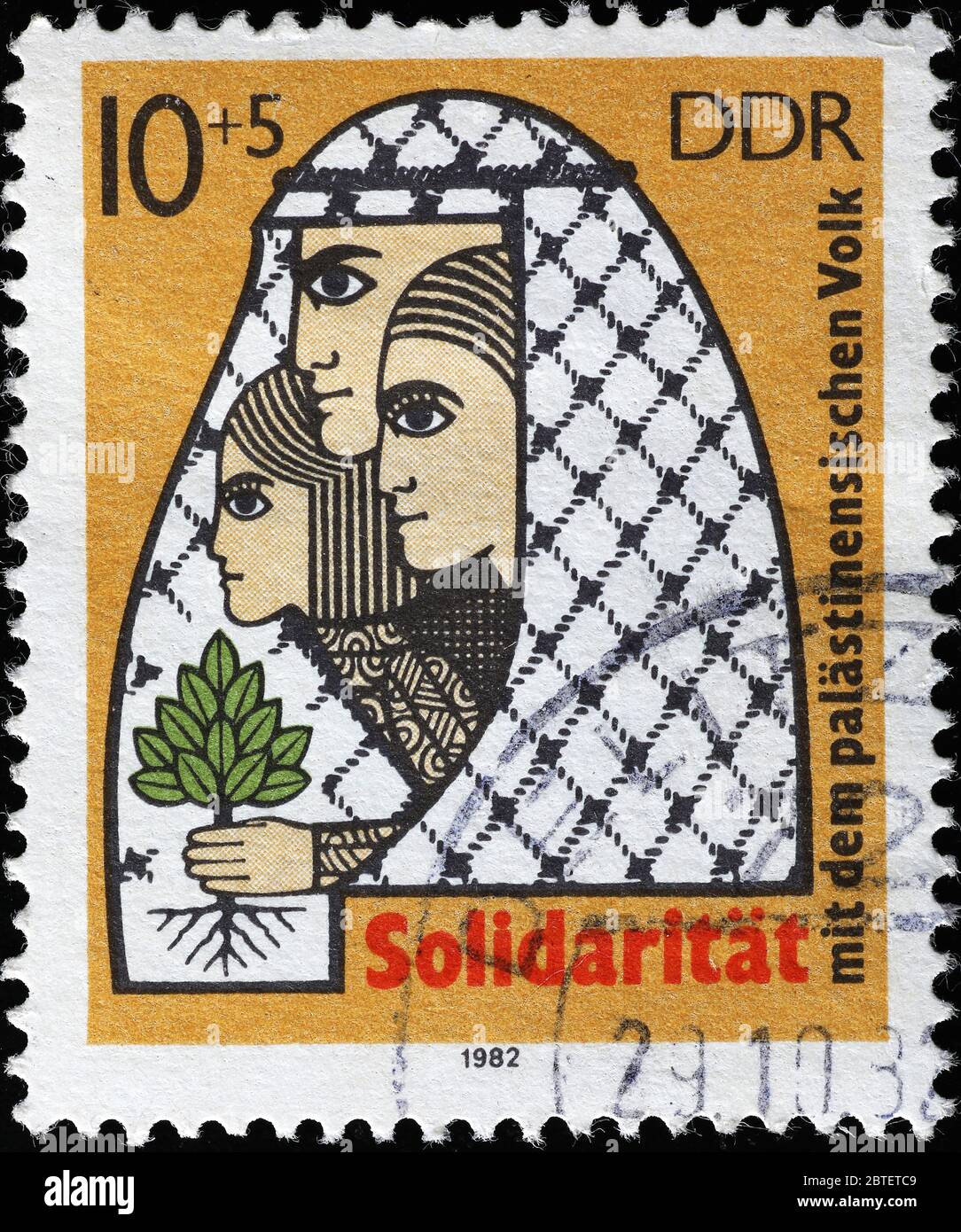 Solidarietà per la causa palestinese sul vecchio timbro della DDR Foto Stock