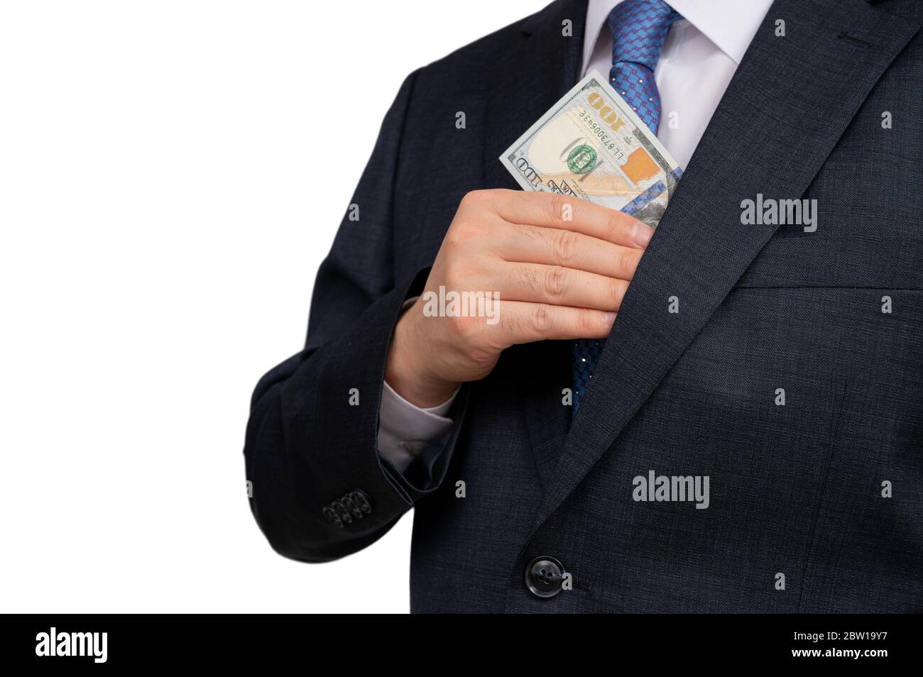 Un uomo d’affari che tiene in mano dollari americani. Foto Stock