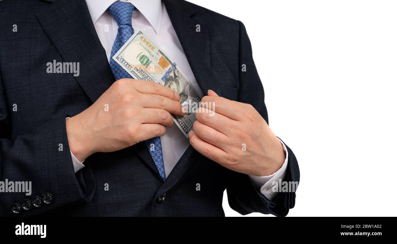 Un uomo d’affari che tiene in mano dollari americani. Foto Stock