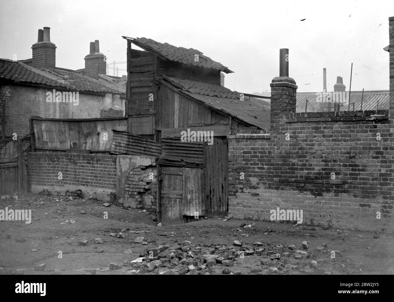 Una buca per fumo a Stepney, East End, Londra. 1933 Foto Stock