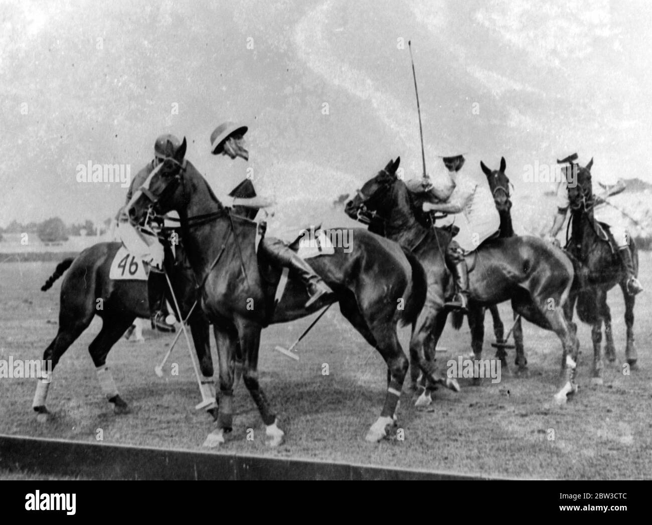 Giocando a polo Foto Stock