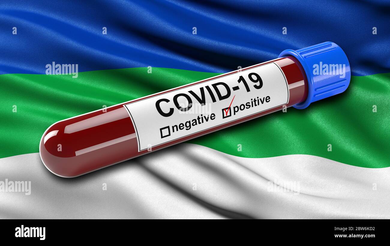 Bandiera della Repubblica di Komi che sventolava nel vento con una provetta per il prelievo ematico Covid-19 positiva. Foto Stock