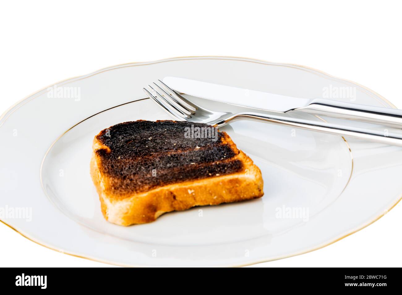 Toastbrot wurde beim toasten verbrannt. Verbrannte Toastscheiben beim Fruehstueck. Foto Stock