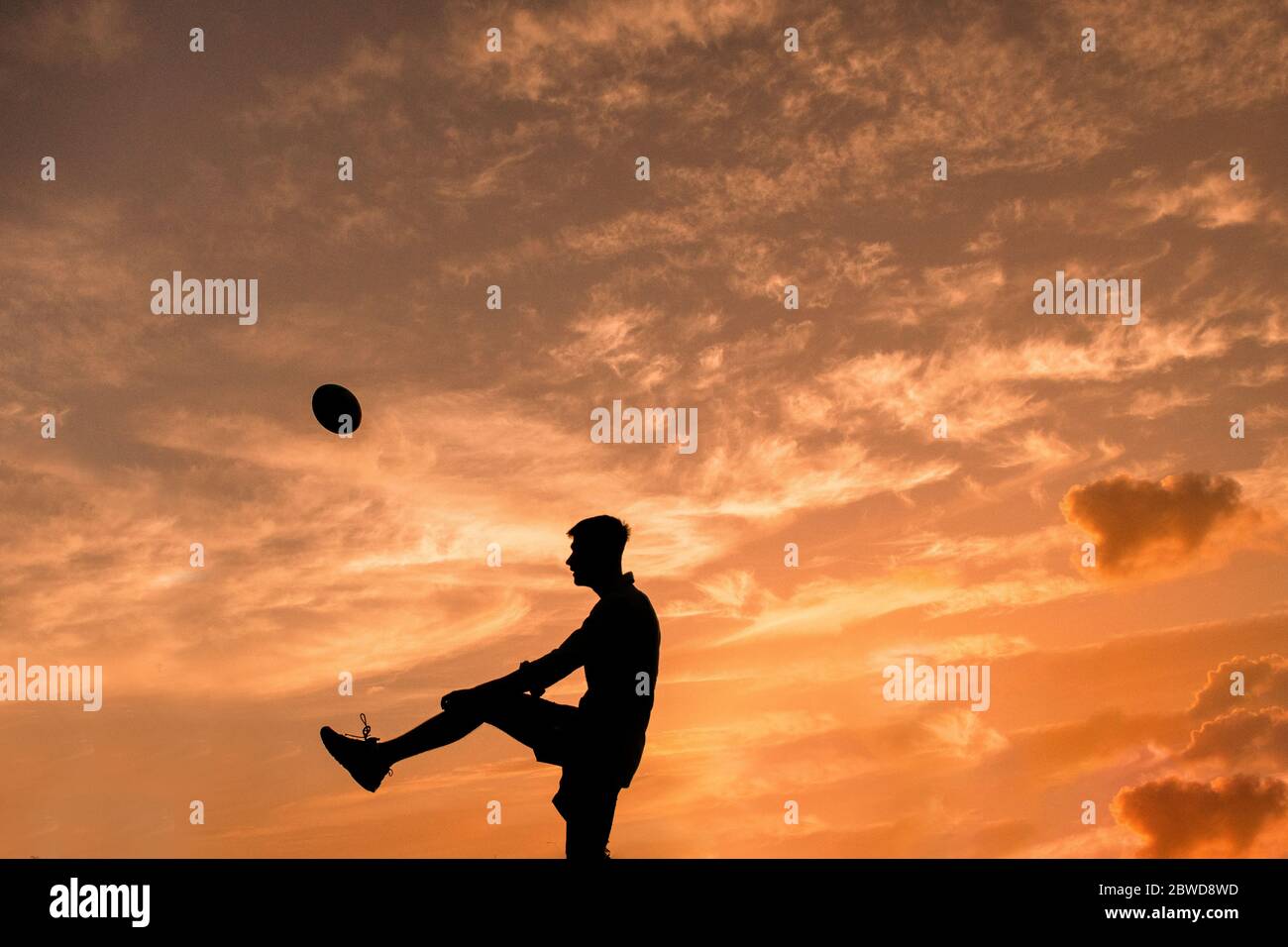 Allenamento di Rugby al tramonto Foto Stock