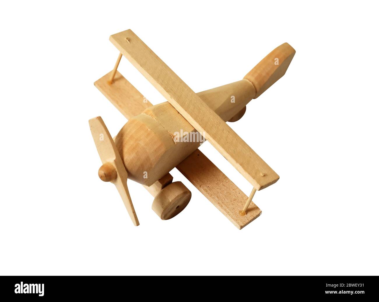 Piccolo aeroplano in legno isolato su sfondo bianco con percorso di ritaglio Foto Stock