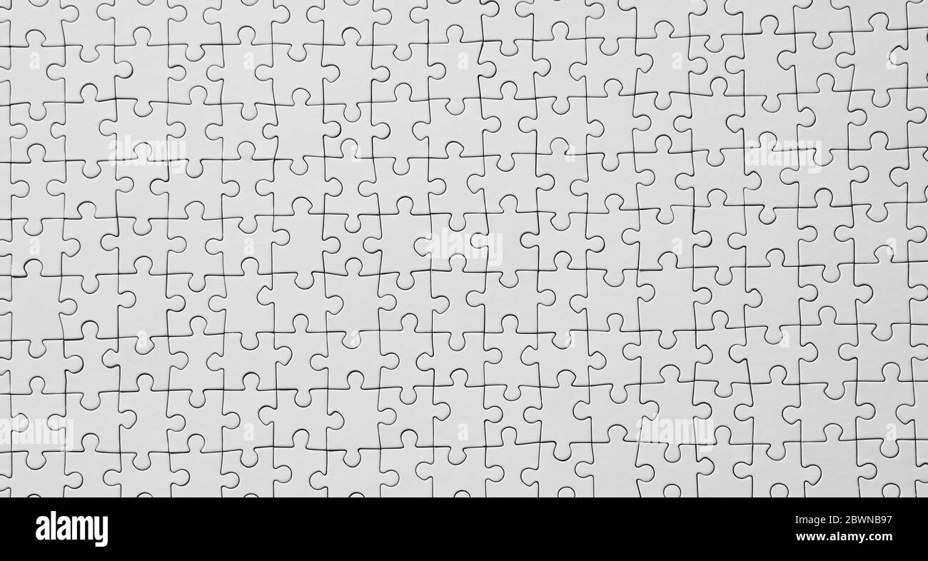 Sfondo da una soluzione di successo a un puzzle bianco. Vista dall'alto Foto Stock