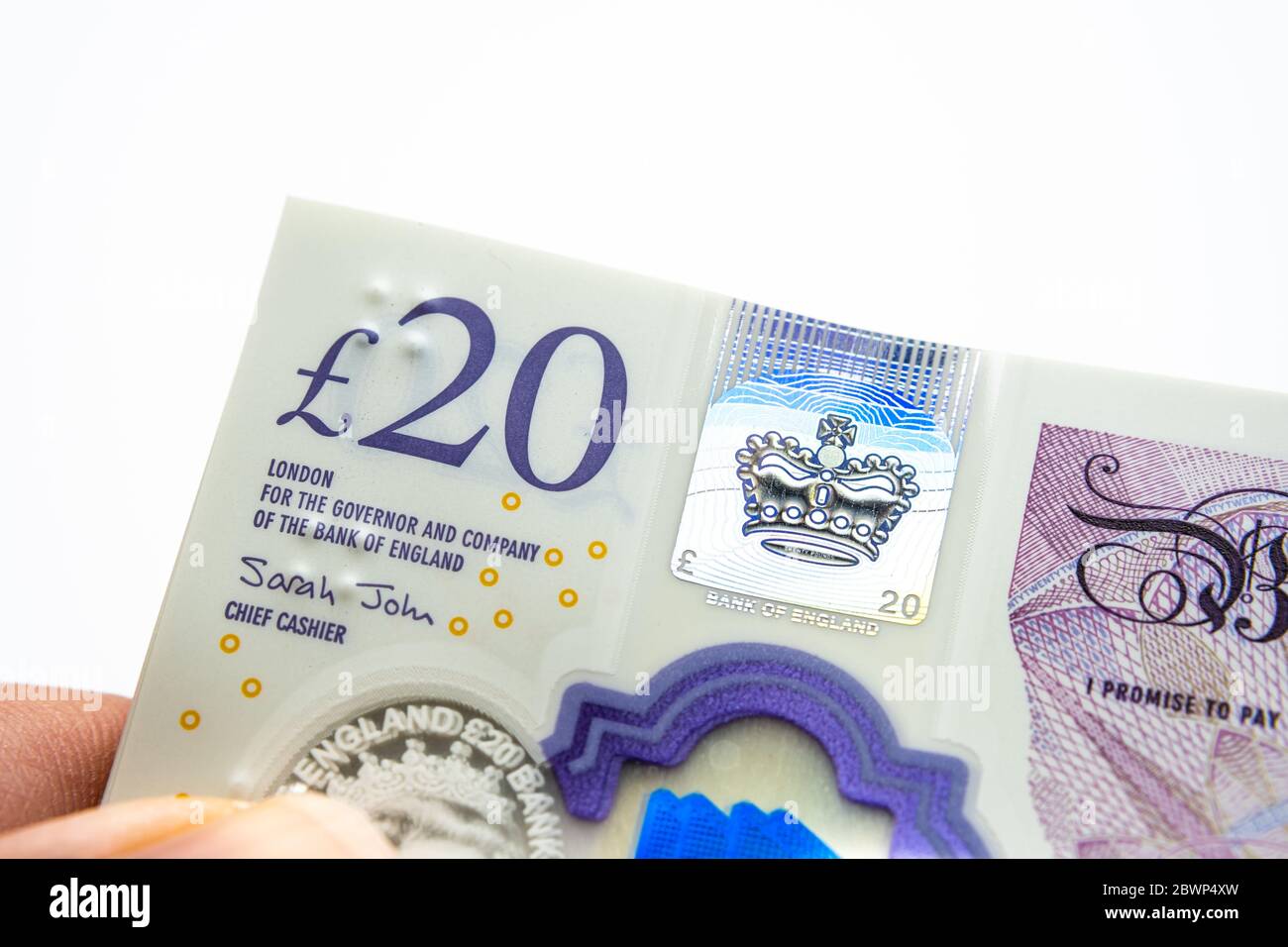Banconote da 20 sterline. Angolo della pila. Nuovi soldi britannici dei polimeri. Foto macro. Foto Stock