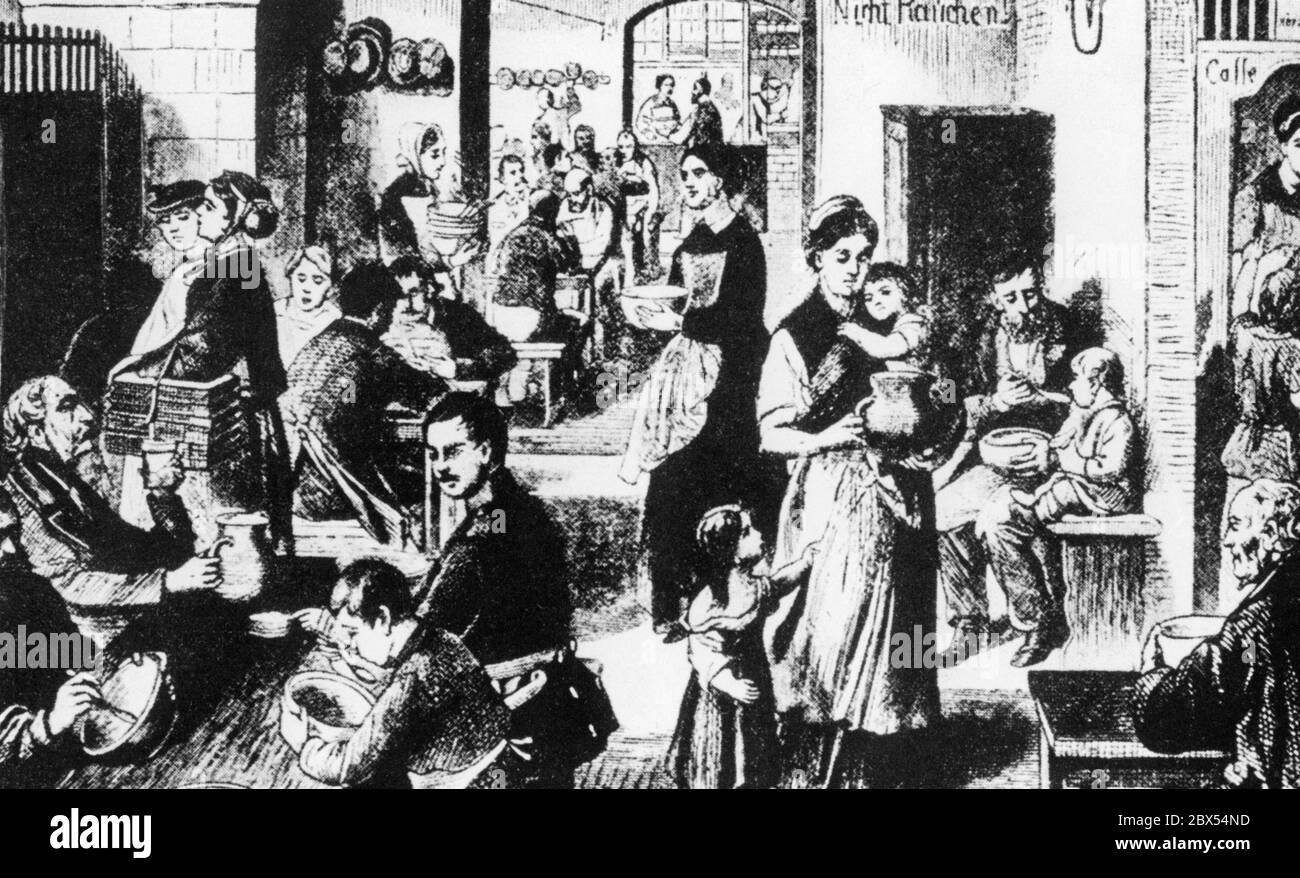 Le famiglie povere mangiano nel Volkskueche (cucina per zuppe) di Berlino. Sul muro dice "non fumare". Fotografia non datata, ca. 1860 Foto Stock