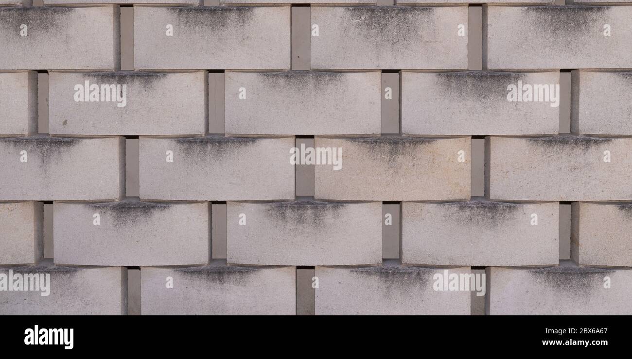orizzontale moderno cemento piastrella sfondo grigio cenere blocco parete grigio rivestimento motivo carta parati senza cuciture texture Foto Stock
