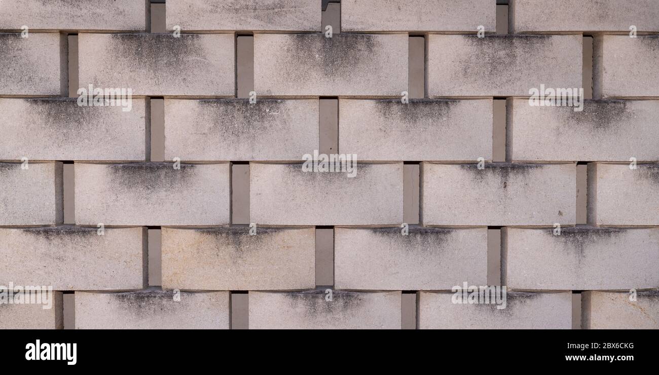 Cemento piastrelle cenere blocco parete rivestimento texture grigio sfondo Foto Stock