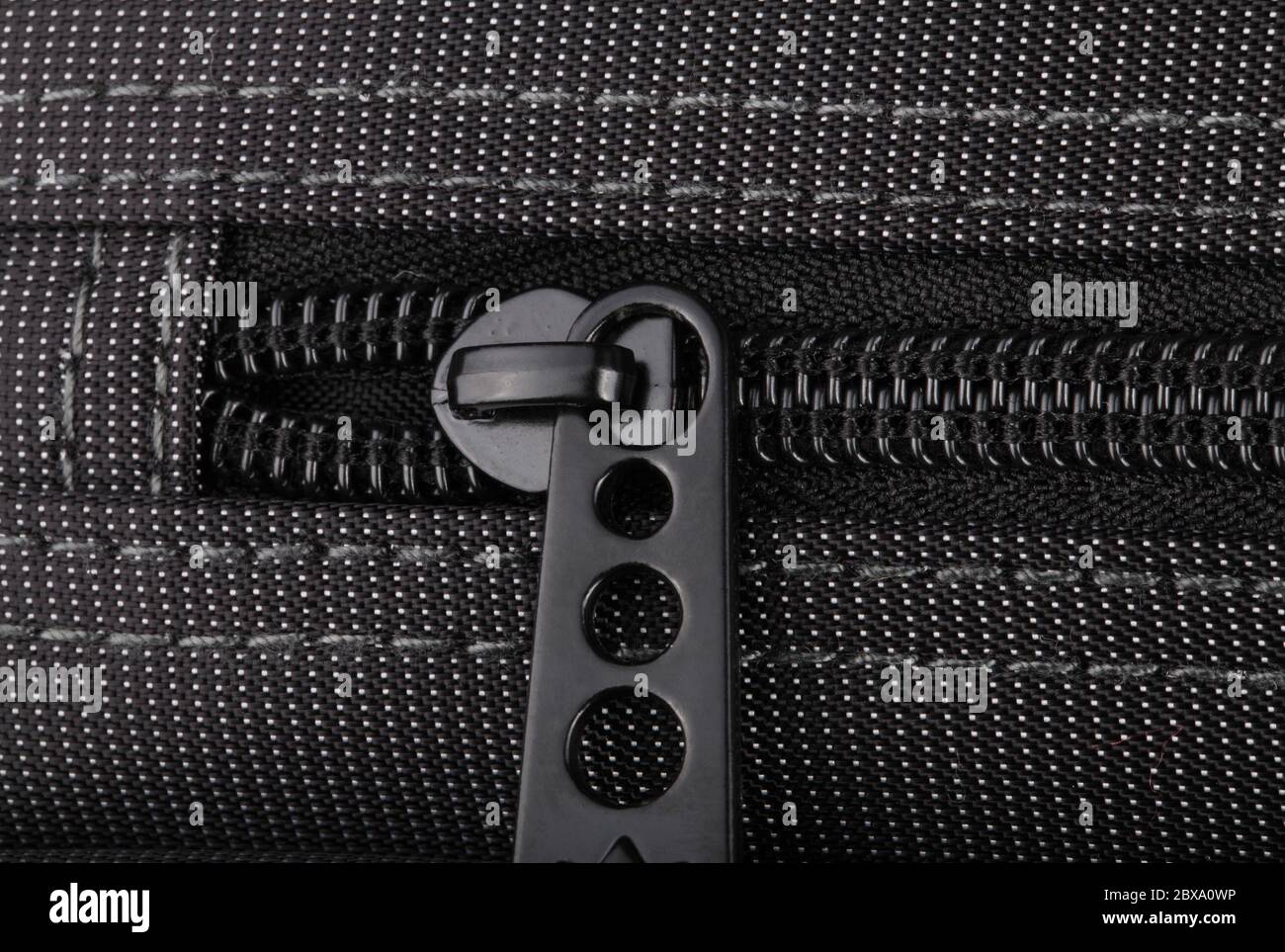 Borsa nera con puntini bianchi Foto Stock