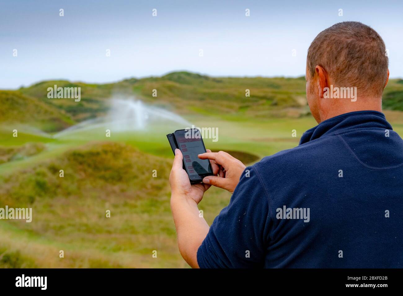 Sistema di irrigazione su campo da golf Foto Stock