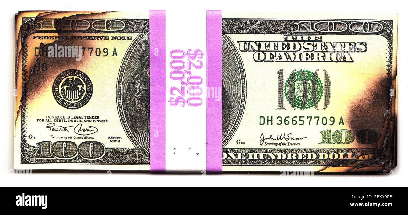 100 le fatture del dollaro bruciato perdita finanziaria recessione rischio di depressione Foto Stock