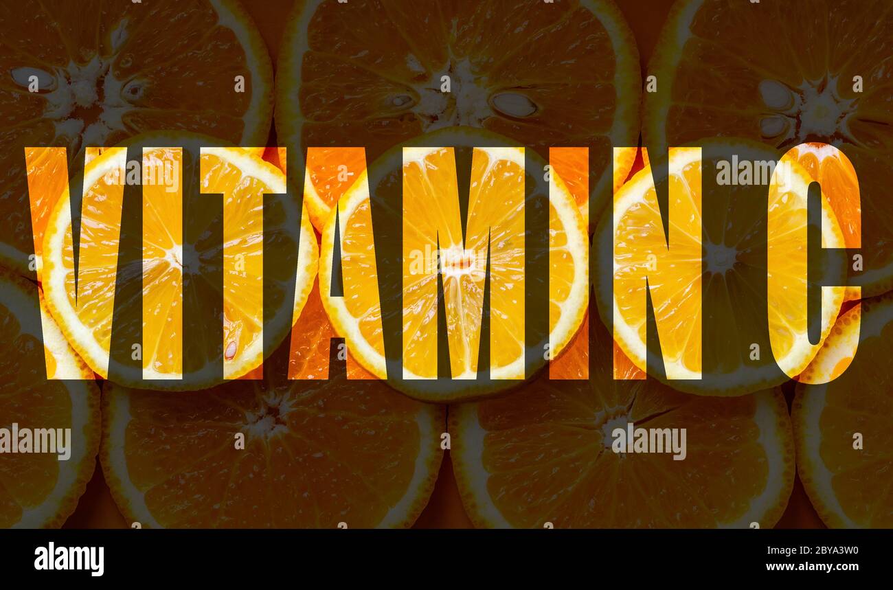 iscrizione vitamina c su sfondo di agrumi Foto Stock