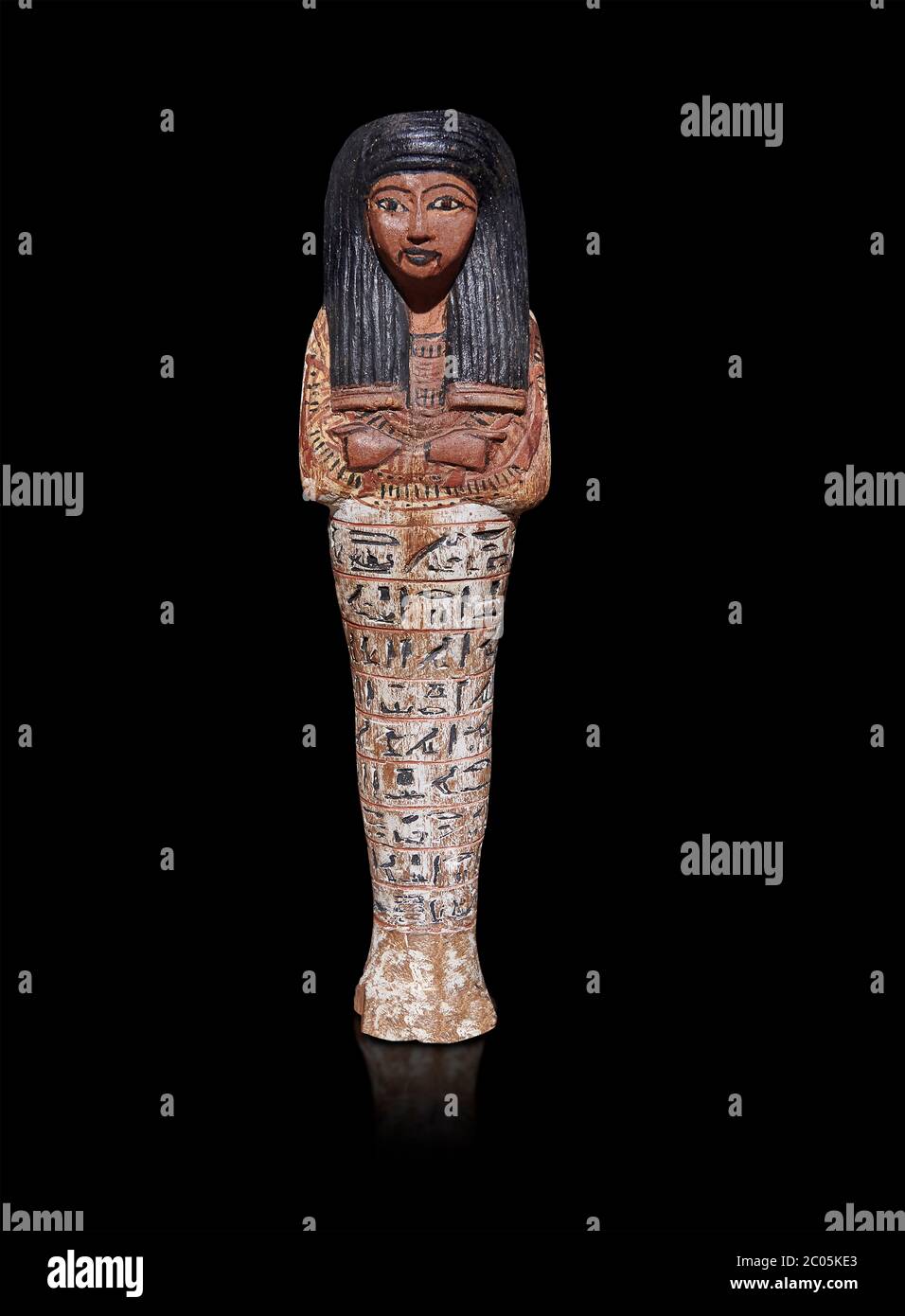 Antica bambola di shabtis egiziano, nuovo regno,. Museo Egizio, Torino. Sfondo grigio. Foto Stock