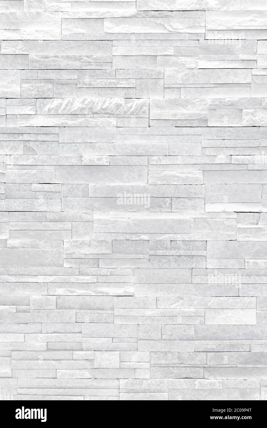 Piastrelle in pietra impiallacciata lamellato piano rendono belle e moderne pareti accento nel design degli interni. USA questa texture grigia come sfondo, sfondo, sfondo... Foto Stock
