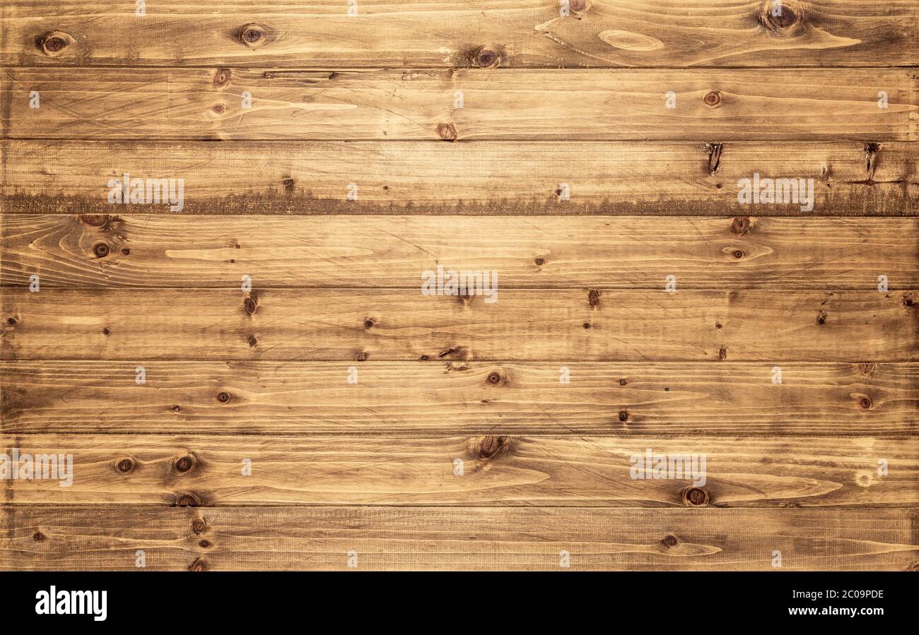 Sfondo di legno marrone chiaro visto dall'alto. Le tavole di legno usurate sono impilate orizzontalmente. Risorsa di progettazione per parete, pavimento, tavolo ecc. Foto Stock