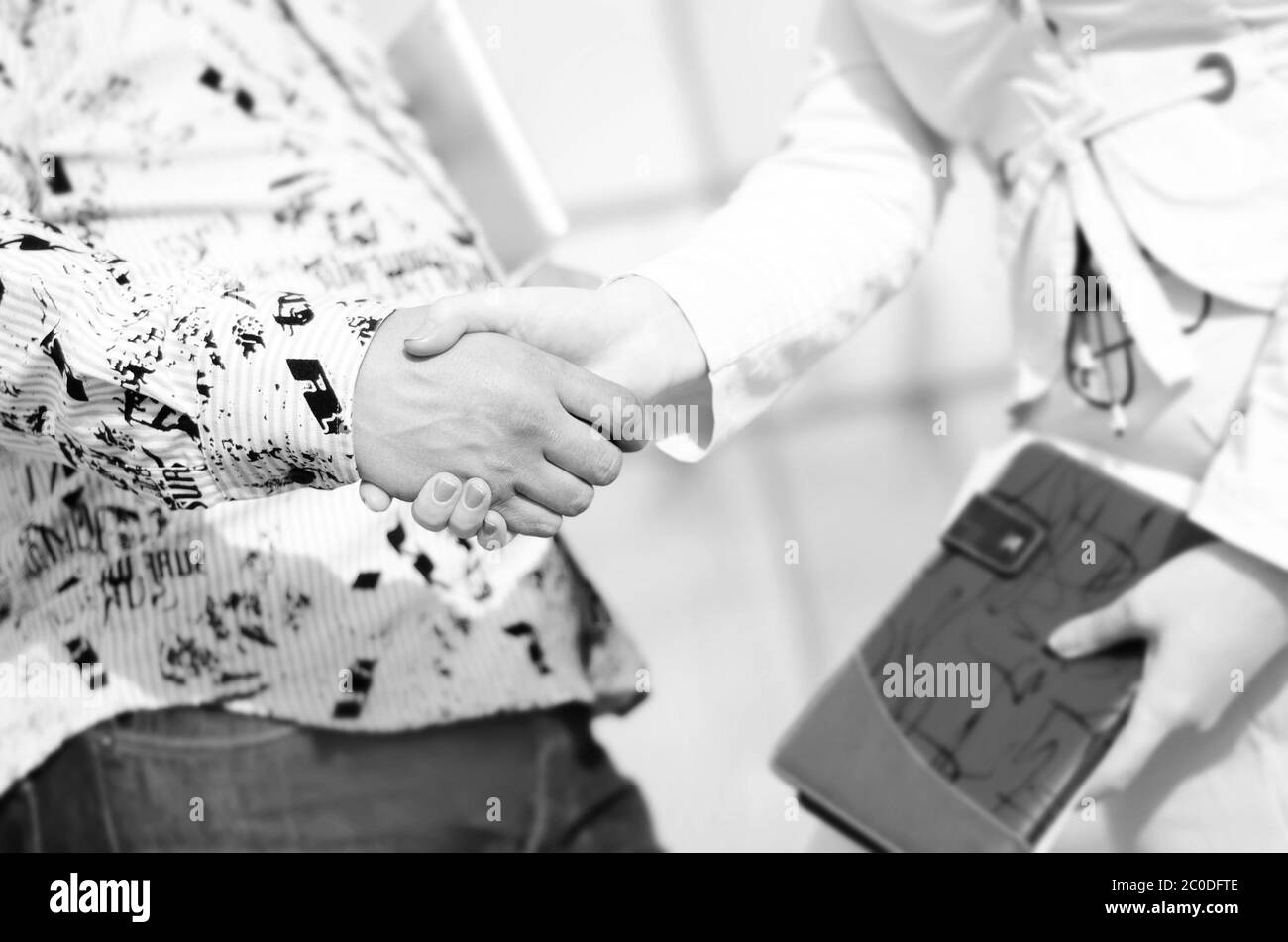 stretta di mano Foto Stock