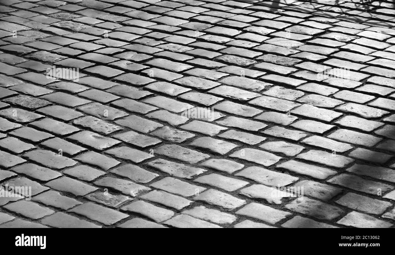 Pavimentazione in pietra in giornata di sole. Foto Stock