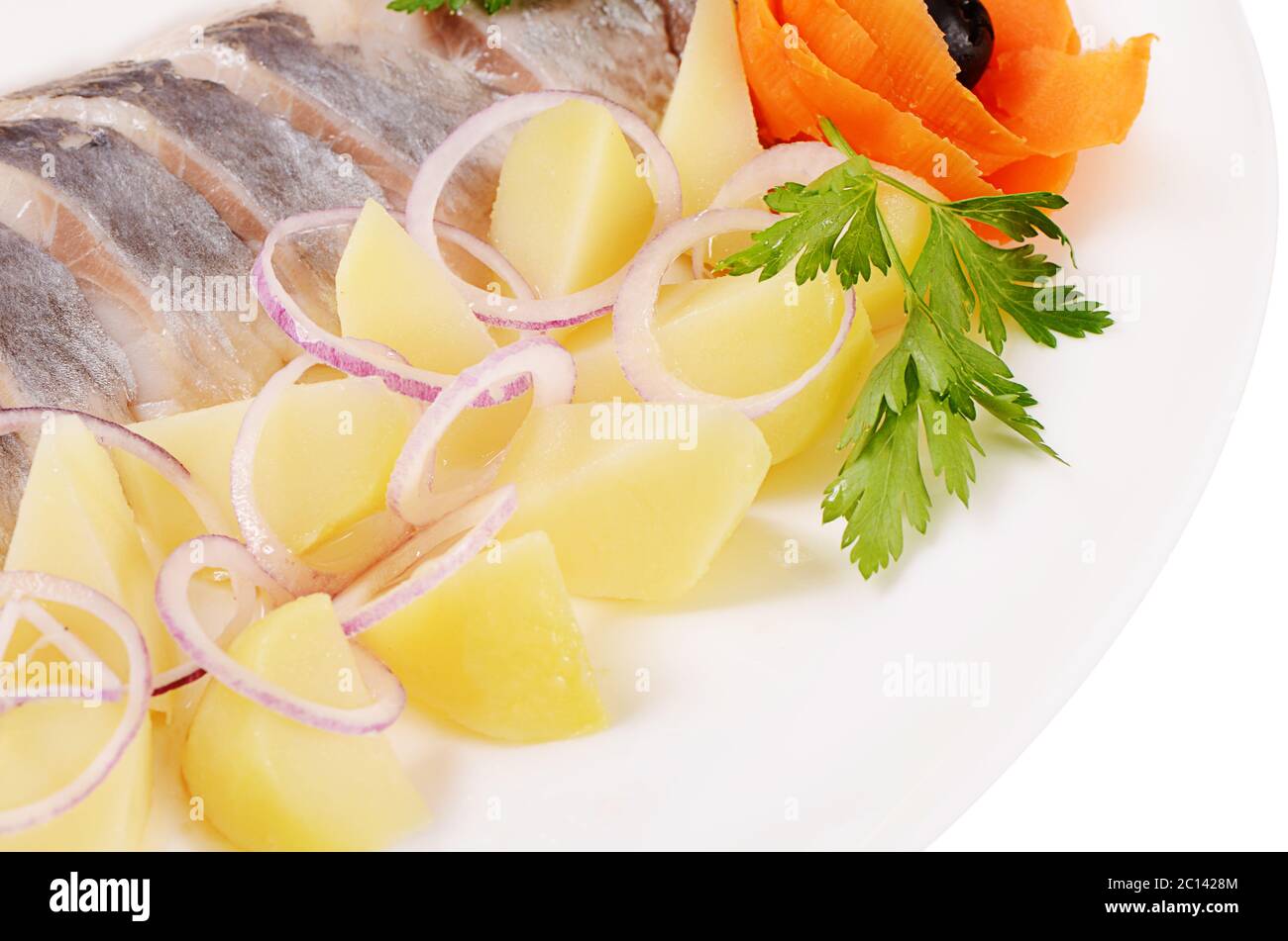 Aringhe salate con patate bollite Foto Stock