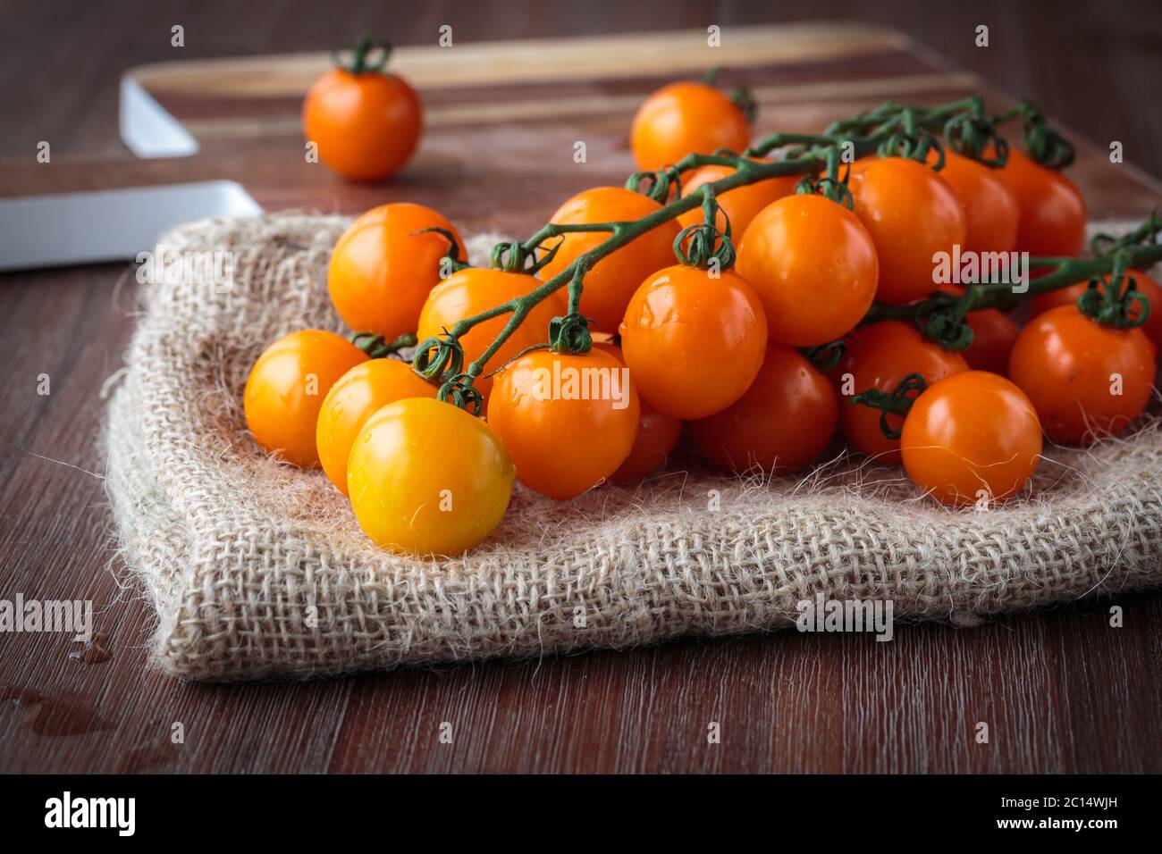 Pomodori ciliegini d'arancia freschi Foto Stock