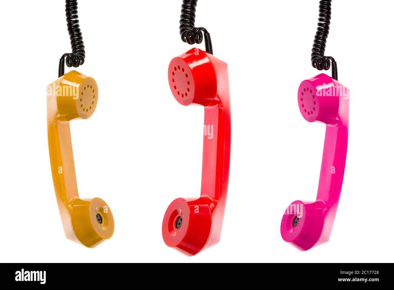 Tre ricevitori telefonici colorati Foto Stock