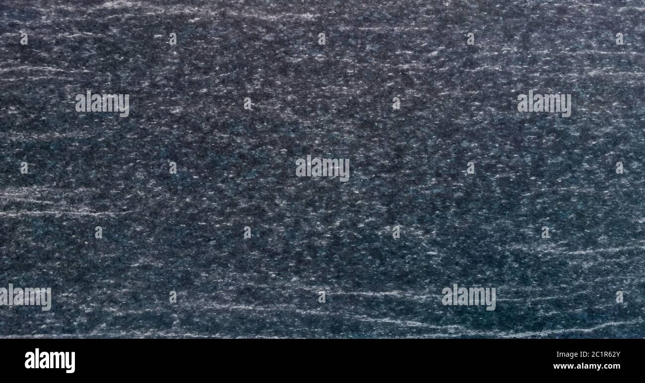 Texture e sfondo senza giunture di granito nero. Foto Stock