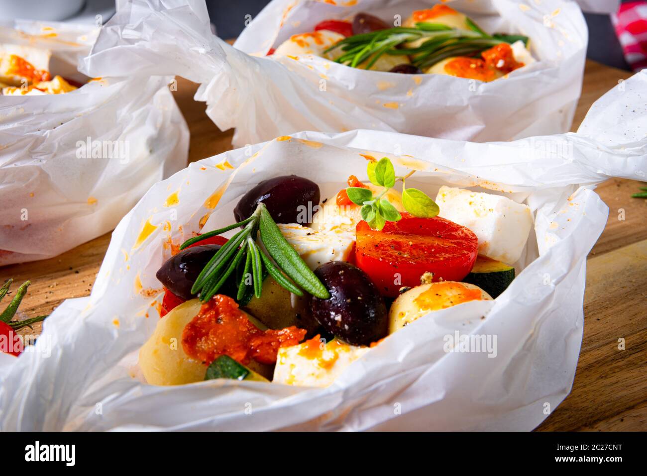 gnocchi al forno con pomodori zucchini e formaggio di pecora a dadini Foto Stock