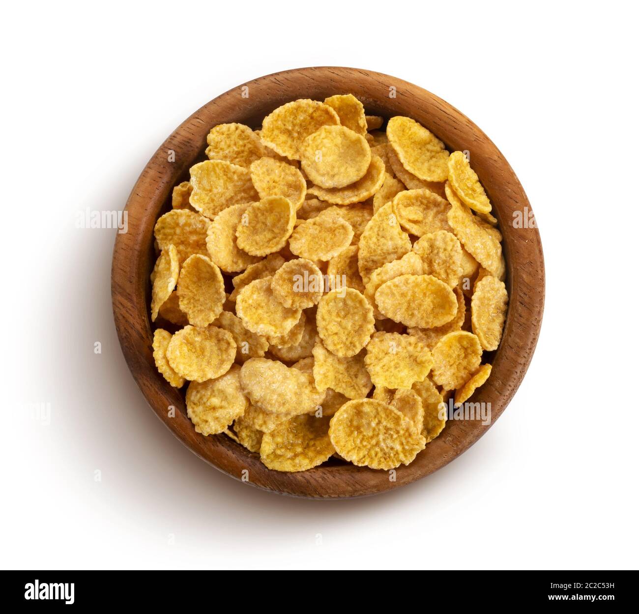 Fiocchi di mais in ciotola di legno isolato su sfondo bianco Foto Stock