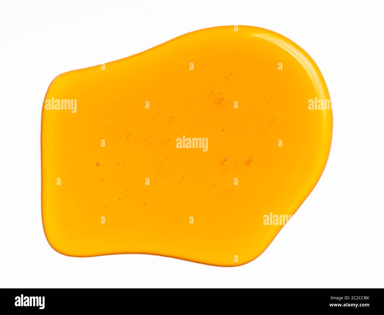 Miele goccia astratto modello o sfondo, isolato su bianco Foto Stock