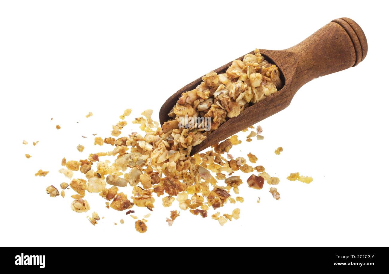 Granola con noci in paletta isolata su fondo bianco con percorso di ritaglio Foto Stock