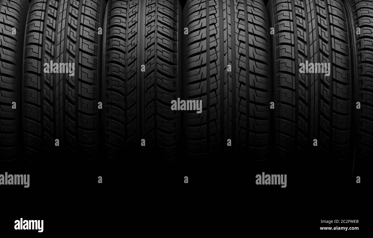 Una serie di ruote o pneumatici per auto giacciono in fila all'ombra su uno sfondo nero. Simulate in su per il servizio di automobile di pubblicità o la manutenzione auto. Spazio di copia. 3D Foto Stock
