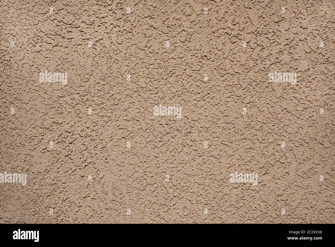 Una parete di stucco texture sfondo beige chiaro Foto Stock