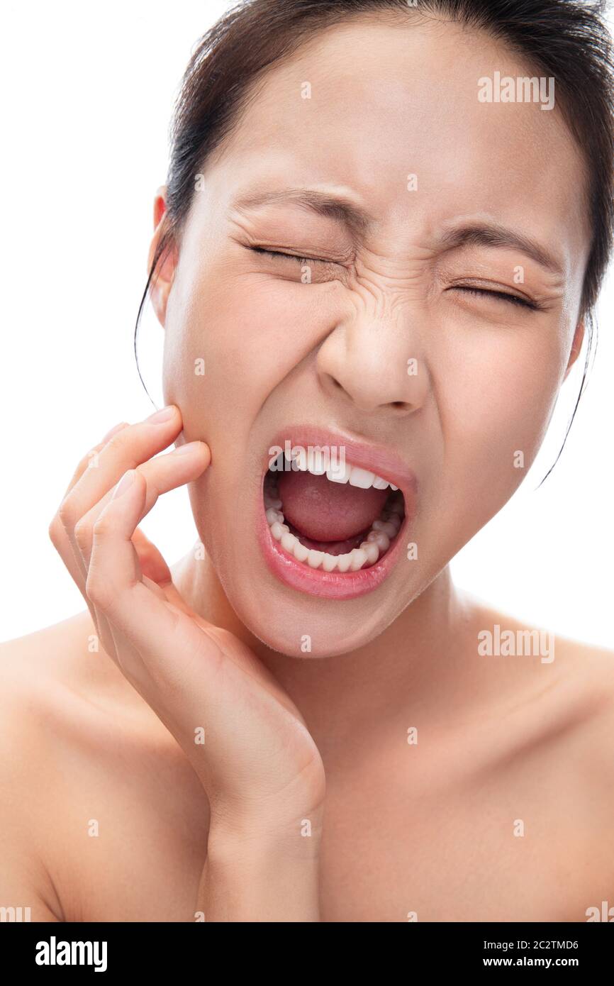 Giovane donna con mal di denti Foto Stock