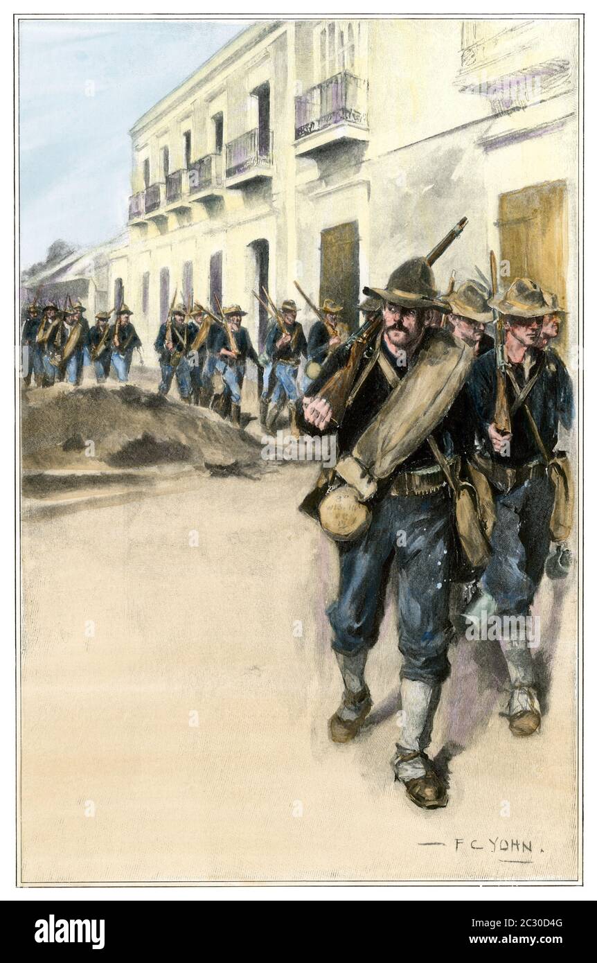I volontari del terzo Wisconsin entrano a Cuomo, Porto Rico, guerra spagnolo-americana, 1898. Mezzitoni colorati a mano di un F.C. Illustrazione Yohn Foto Stock