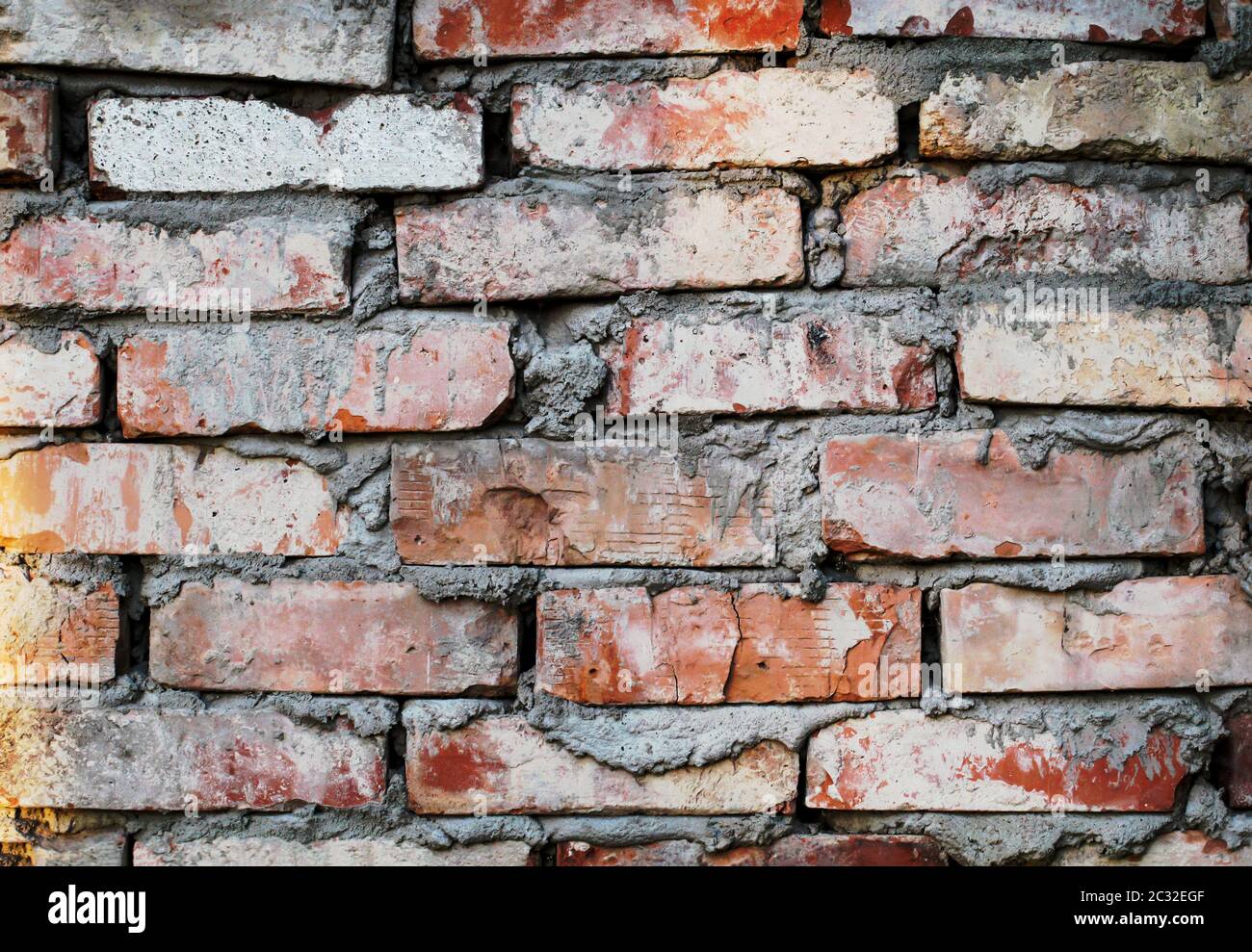 una parete di pietra di pietre di mattone, struttura di parete di pietra Foto Stock