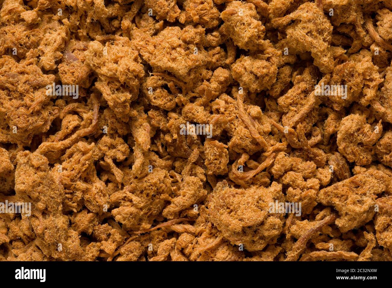 primo piano di fondo di cibo di filo di maiale essiccato Foto Stock