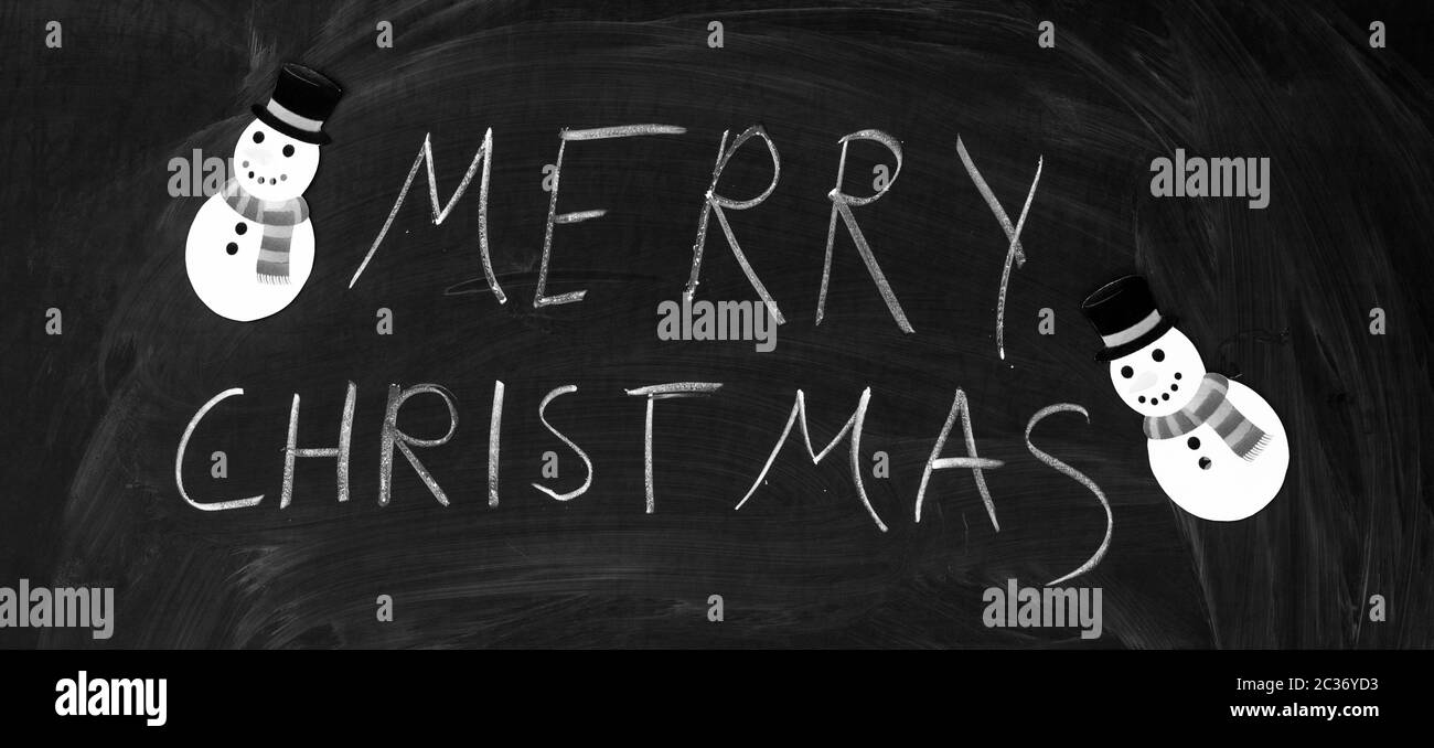 Buon Natale scritti sulla lavagna con gesso Foto Stock
