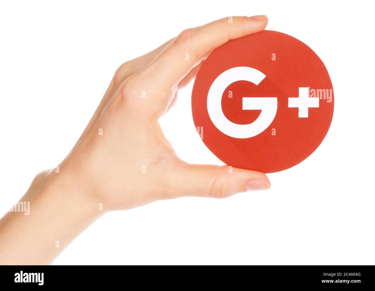 Kiev, Ucraina - 21 febbraio 2019: La mano tiene Google più icona stampata su carta. Google sta chiudendo il suo social network Google Plus Foto Stock