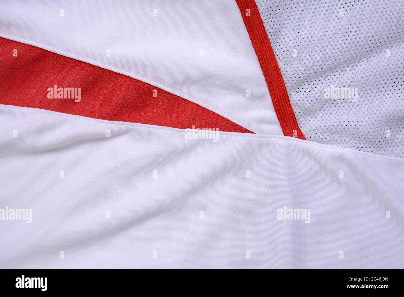 Tessuto in Jersey rosso e bianco, sfondo sportivo. Foto Stock