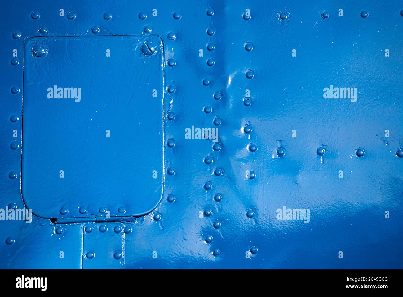 Vernice blu rivettato piatto di un aereo per sfondi Foto Stock