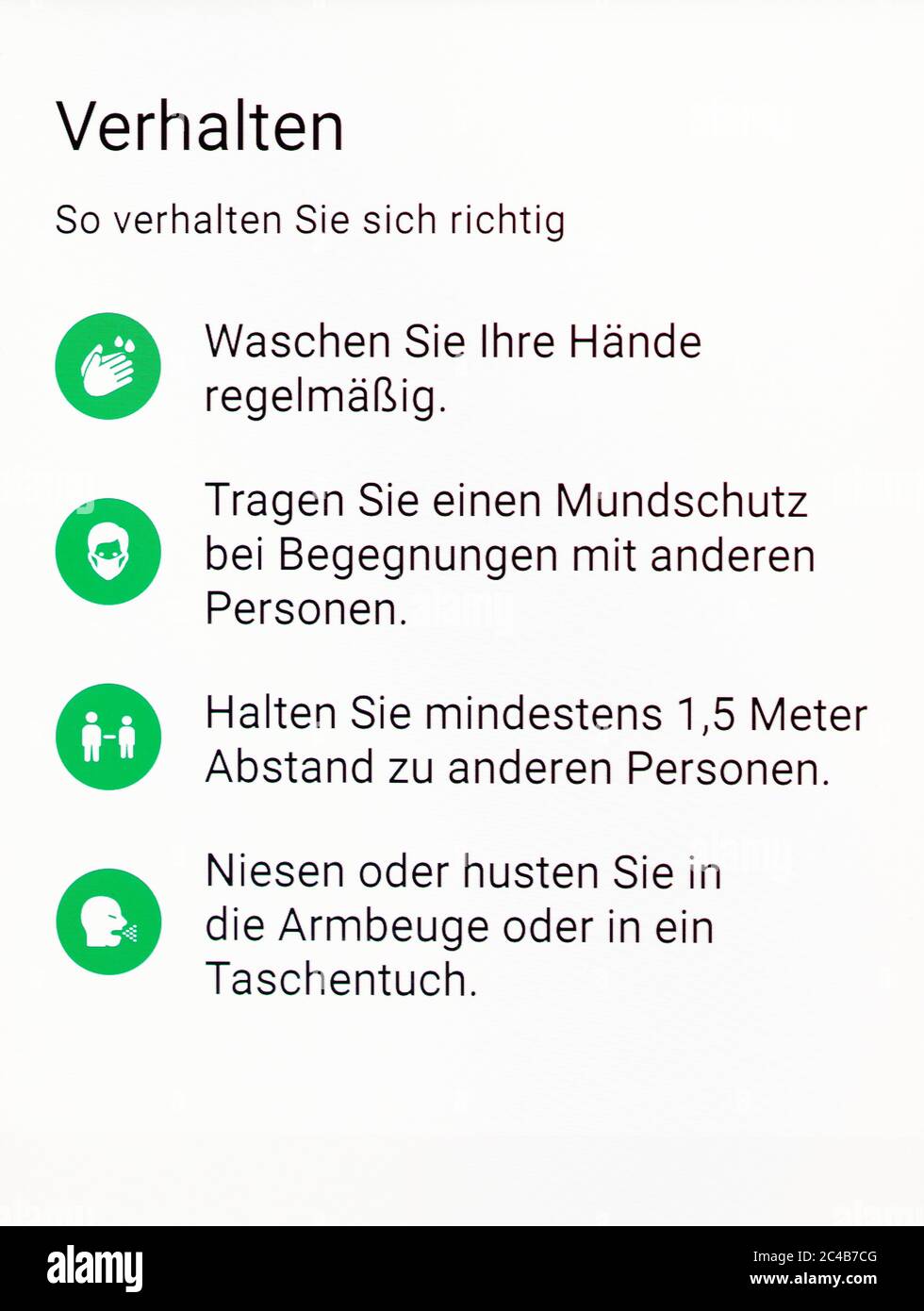 Applicazione di avviso corona, comportamento, come comportarsi correttamente, display del telefono cellulare, Germania Foto Stock
