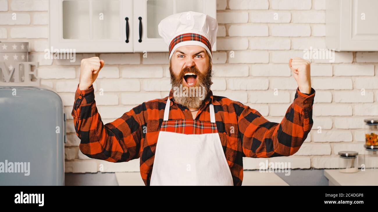 Chef, cuoco o panettiere molto felice di buon gusto con la mano Foto Stock Chef, cuoco o panettiere molto felice di buon gusto con la mano Foto Stock