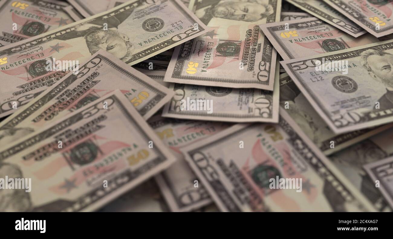 Una vista ravvicinata di una pila sparsa di banconote in dollari USA - rendering 3D Foto Stock