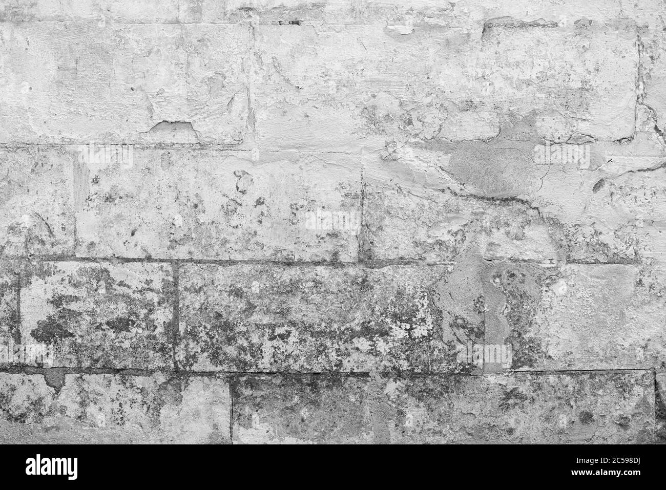 Vecchio muro di pietra sfondo. Struttura di mattone resistente agli agenti atmosferici Foto Stock
