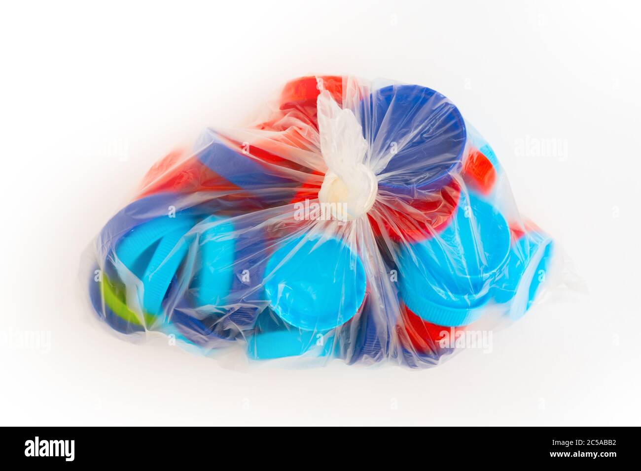 Tappi per bottiglie in plastica. Raccolta rifiuti separata. Smaltimento dei rifiuti. Foto Stock Tappi per bottiglie in plastica. Raccolta rifiuti separata. Smaltimento dei rifiuti. Foto Stock